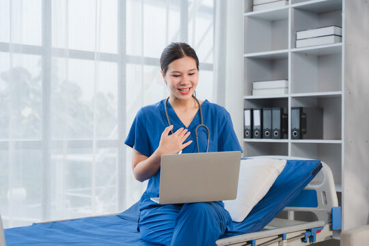 Doctor in Virtual Consultation: A compassionate nurse in blue scrubs conducts a telehealth appointment, her laptop open and stethoscope around her neck.