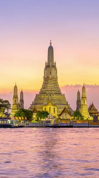 Wat Arun Ratchawararam at sunset(Temple of Dawn) famous tourist destination in Bangkok, Thailand. Vertical