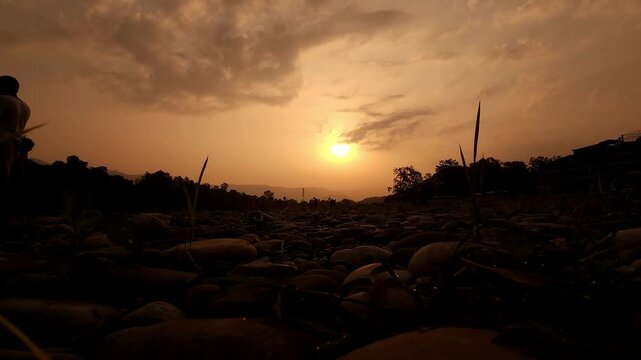 Devghat Dham Sunrise in Nepal, Golden Morning Sun over Sacred Riverbank with Hindu Pilgrims, Peaceful Spiritual Landscape, Religious Pilgrimage, Himalayan Culture and Scenic Travel Destination