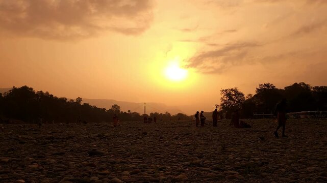 Devghat Dham Sunrise in Nepal, Golden Morning Sun over Sacred Riverbank with Hindu Pilgrims, Peaceful Spiritual Landscape, Religious Pilgrimage, Himalayan Culture and Scenic Travel Destination