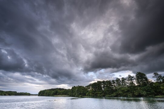 Threatening storm clouds over a lake in M&uuml;ritz National Park, Feldberg Lake District, Mecklenburg-Western Pomerania, Germany