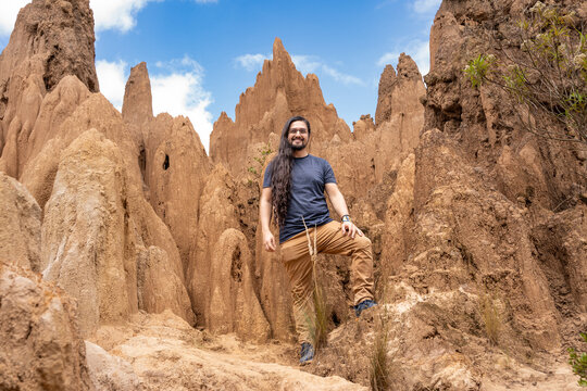Man Posing Among Eroded Clay Hoodoo Formations. Tatacoita - Nemocon