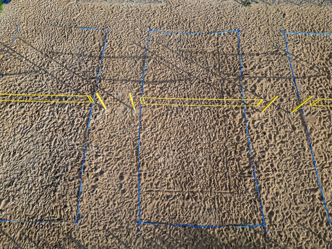 Aerial view of Vihiluoto beach volleyball courts with sand surfaces and marked boundaries in Kempele, North Ostrobothnia, Finland.