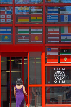 Geneva, Switzerland, Europe :  International Organization for Migration (IOM) a United Nations agency, flags of IOM member states behind the glass