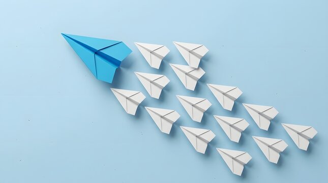 Blue paper airplane leading a distinct formation of white paper airplanes flying together on a solid light blue background, symbolizing leadership, innovation, and breaking away from the conventional