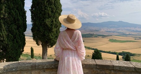 Fototapeta premium Woman and lady traveler enjoy the panoramic tuscany italy landscape and scenery