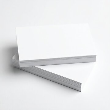 a stack of white business cards on a white background