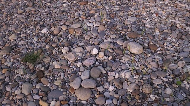 Devghat Dham Sacred Riverbank in Nepal, Smooth River Stones and Pebbles on Natural Riverside, Peaceful Hindu Pilgrimage Site, Nature and Spiritual Travel