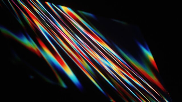Abstract vibrant light streaks with rainbow colors creating a dynamic, angular design for modern backgrounds.