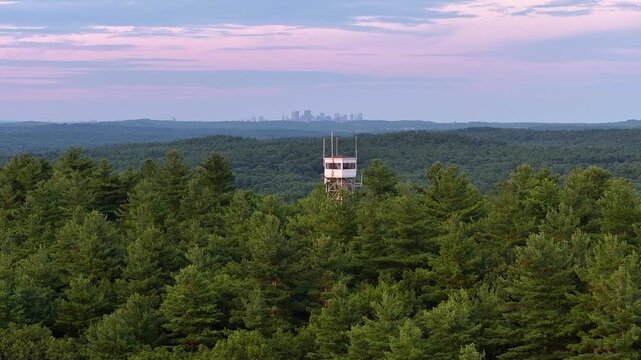 Sunset Aerial View of Snow Hill with the Boston Skyline in Dover Massachusetts