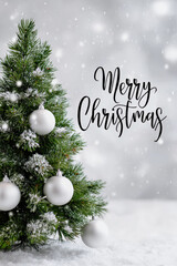 Obraz premium Christmas tree with decorations and snowy background in winter