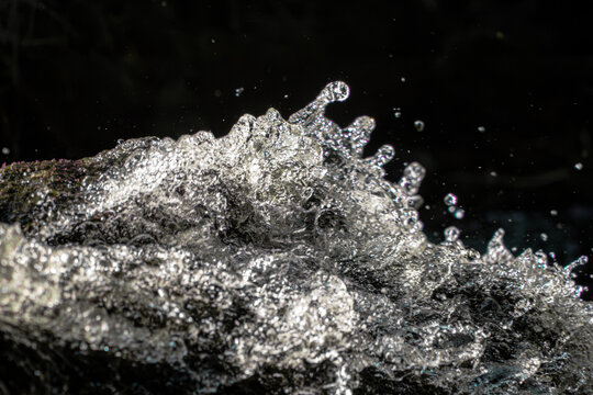 Waterfall splash macro. Water texture background. Fresh liquid motion. Frozen droplet spray. Cascading stream foam. High speed aqua shot. Dynamic wave action. Pure fluid splash. Crystal clear droplets