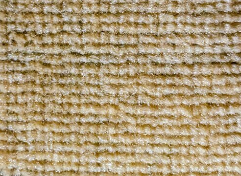 Close up texture of light brown woven fabric upholstery
