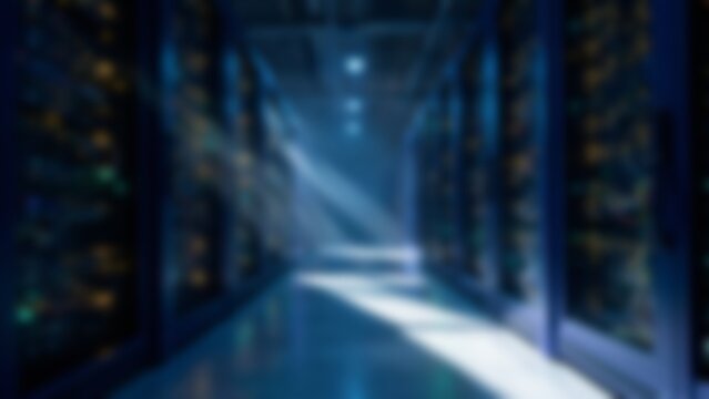 Blurred futuristic data center server racks in symmetrical aisle with dramatic light rays for technology presentation backgrounds, cybersecurity website banners or cloud computing hero images