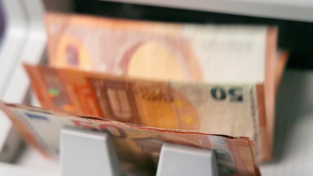 Money Counting Machine Precisely Counts Stack of Fifty Euro Banknotes
