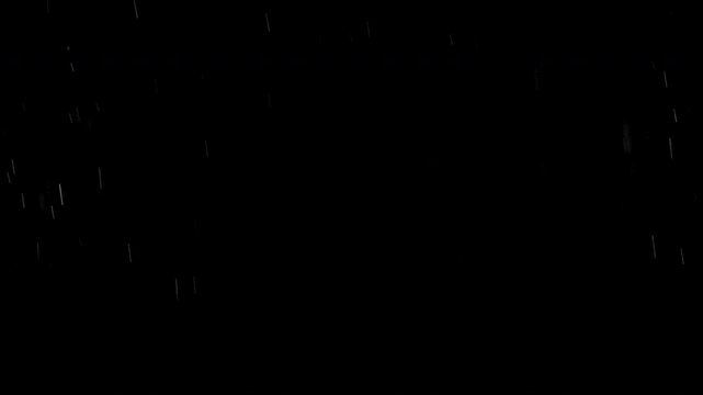 Super slow motion of natural rain drops falling on black background