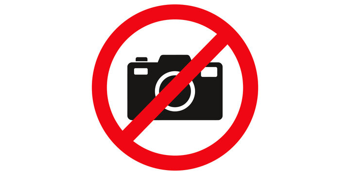 Camera forbidden symbol with red strike-through line on transparent grid.
