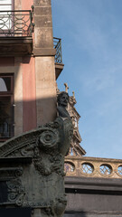Art Nouveau bust and ornate shopfront cornice on a corner building, Porto, Portugal © Svetlana
