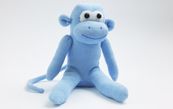 Monkey sock toy isolated on white background
