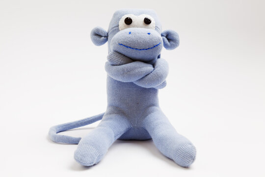 Monkey sock toy isolated on white background