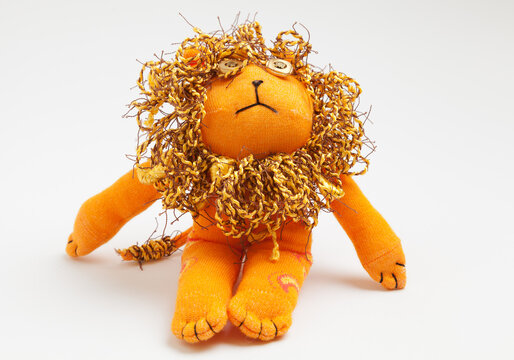 Lion sock toy isolated on white background