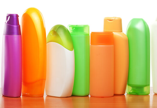 Row of cosmetics isolated on white background. Close up