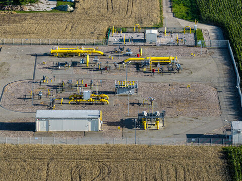Aerial view of the Zakladowa Straz Pozarna PKN Orlen industrial gas facility with yellow pipelines and technical equipment in Plock, Masovian Voivodeship, Poland.