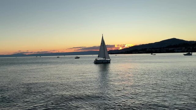 Sailboat on Lake Geneva during sunset in Montreux, Switzerland