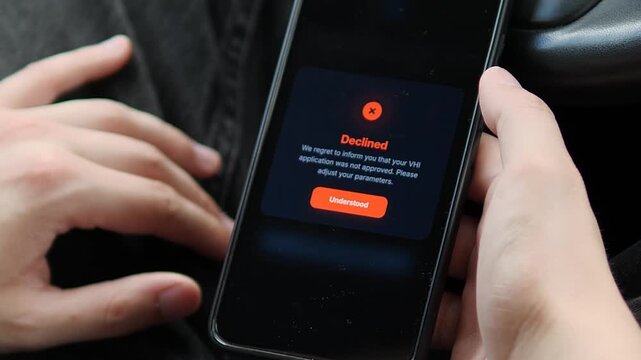 Mobile user receives a declined application notice, reflecting automated financial screening, digital lending decisions, credit risk assessment and the realities of online finance.