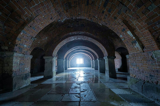 Vaulted brick undercroft with groin vaults on squat piers