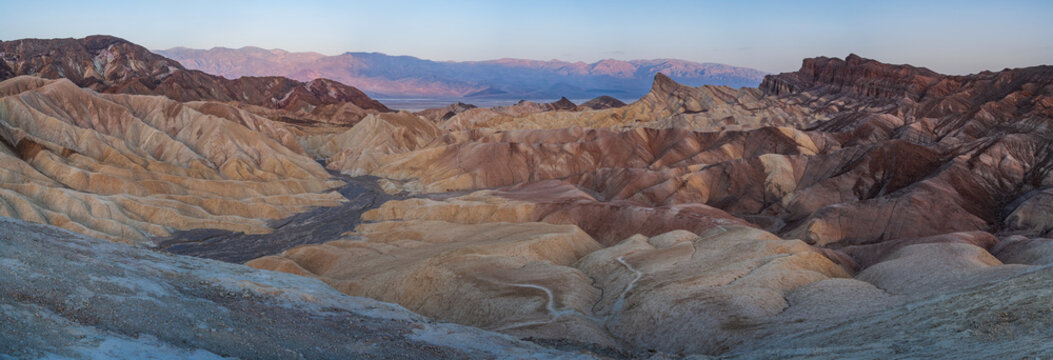 Beautiful wide panorama of badlands and Manly Beacon at sunset in Zabriskie Point