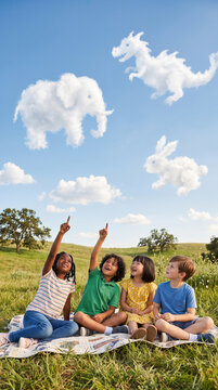 Children watching clouds and imagining animals and fantastical shapes in the sky, outdoor relaxation and imagination, simple landscape, soft cloud shapes, peaceful Children's Day concept