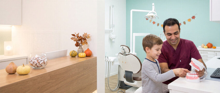 Male Pediatric Dentist Explaining Tooth Model to Boy for Halloween Cavity Prevention Checkup