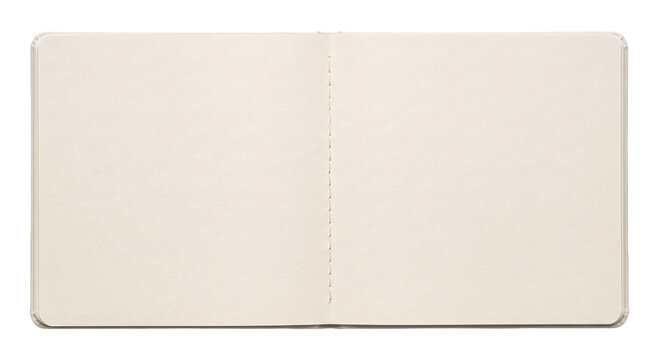 Open blank notebook with cream pages and stitched binding, ready for writing
