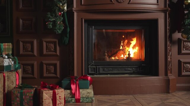 Many gift boxes in classical Christmas decorated interior living room library with fireplace. Christmas gift near fir tree. Modern classic style interior design apartment. Christmas eve at home