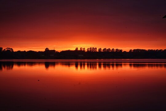 Reflected sunset with a burning sky at Windebyer Noor, Eckernf&ouml;rde