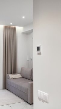 white thermostat for underfloor heating and climate control systems. control panel. apartment, house, hotel. smart home. automatic heating system. technology. stylish designer expensive repair