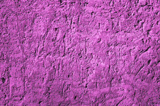 Purple background, photo of the texture of an old wall with various lines, embossing, and brushstrokes