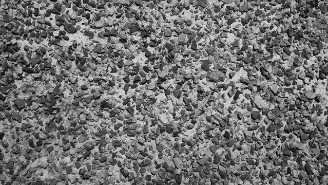 Gray background, photo of concrete tiles with stone inclusions