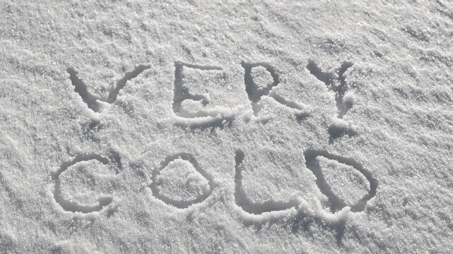 Snow background, photo of snow texture in winter and letters indicating it is very cold