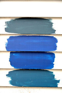 paint sample colors on the side of a historic home