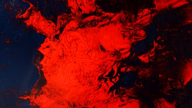 Red Acrylic Fluid Art Macro Background Flowing Abstract Paint Texture 4K. Dramatic macro footage of flowing red acrylic paint creating organic lava like patterns against a dark background.