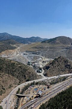 Aerial view of the Floyd Hill quarry and mining operations situated near the interstate highway in the mountainous landscape of Floyd Hill, Colorado, United States.