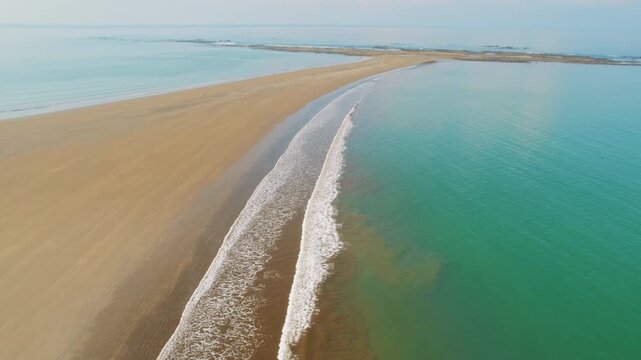 Aerial view of unique Whale Tail sandbar formation at low tide coast in Marino Ballena Park Costa Rica