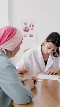 Female doctor prescribing medical cannabis treatment to cancer patient