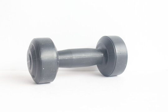 A small black barbell on a white background