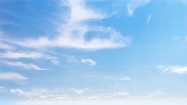 Feathery White Cirrus Clouds Moving Gently Across Azure Sky Loop