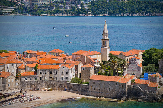 Budva Old Town cityscape with red roofs and Adriatic sea coast in Montenegro