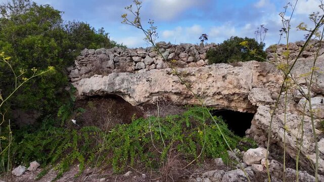 Malta, Xemxija Heritage trail - Entrance of the Punic caves near old farmers hut.