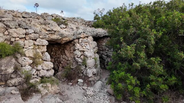 Malta, Xemxija Heritage trail - Entrance of the Punic caves near old farmers hut.